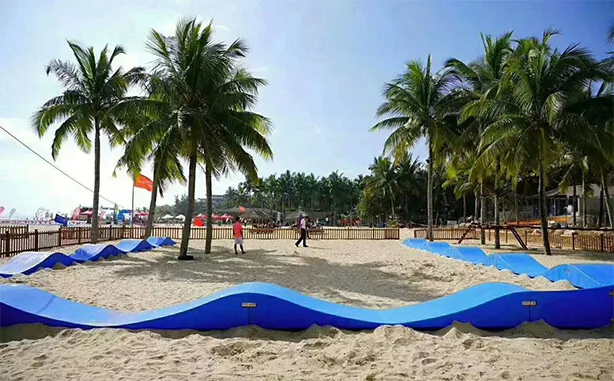 Kids riding scooters and balance bikes on a modular pump track